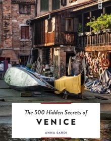 Gondola workshop on canal edge, on cover of 'The 500 Hidden Secrets of Venice', by Luster Publishing.