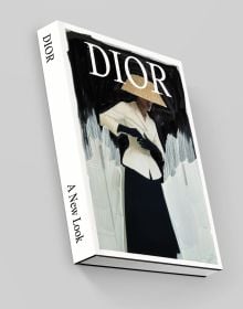 Book cover of Dior: A New Look, with a model wearing a cream jacket, black skirt and woven hat. Published by Waanders Publishers.