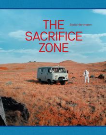 Green soviet mini van, on rocky terrain, figure in white chemical suit, on landscape cover of 'The Sacrifice Zone', by Hannibal Books.