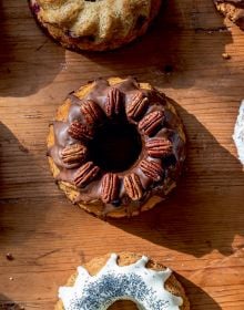 Book cover of The Home Baking Book: Timeless Recipes for Artisanal Treats, with a table of bread, pastries, cakes and tarts. Published by Hannibal Publishers.